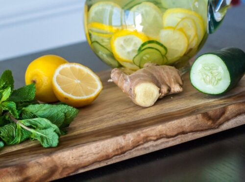 Cucumber Water pitcher with lemons, ginger, and mint leaves. 