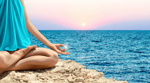 calming yoga by ocean featured