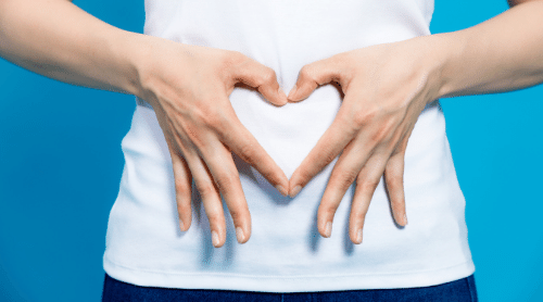 heart hands over stomach healthy gut featured