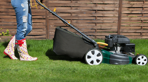 woman mowing the lawn featured