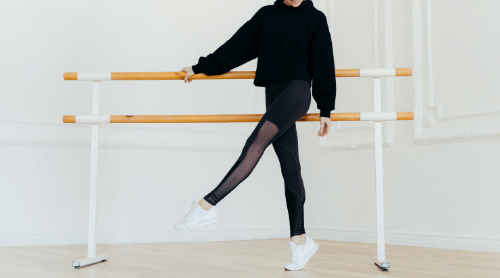 woman doing barre workout featured