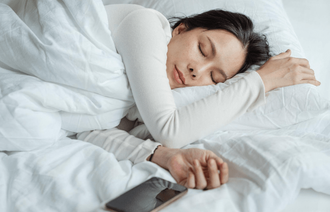 Woman sleeping peacefully in bed